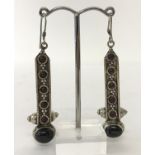 A pair of 925 silver drop earrings, each set with 6 garnet cabochons.