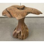 A rustic ornamental garden mushroom.