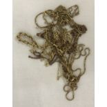 A quantity of 9ct gold broken chains suitable for scrap.
