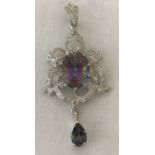 A 925 silver, Art Nouveau style drop pendant, set with mystic topaz and surrounded by clear stones.