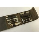 A vintage German Bonsa 11 piece pocket tool kit in a brown leather case.