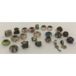 A collection of silver, glass and metal charms and beads for modern charm bracelets.