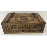 A vintage style, Moet and Chandon advertising 2 handled wooden crate.