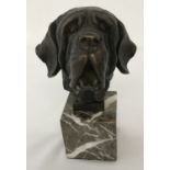 A marble mounted bronze figure of a St. Bernard dogs head, signed Yanez.