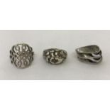 3 modern design silver dress rings.