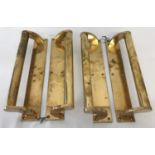 A set of 4 brass bar door handles mounted onto finger plates, with 6 fixing holes.