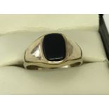 A vintage 9ct gold signet ring set with black onyx. Size N½. Fully hallmarked to inside of band.