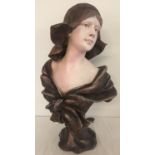 A large Art Nouveau style resin bust of a woman.