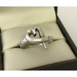 A silver Tiffany & Co "Loving heart" ring by Paloma Picasso.