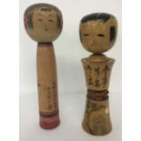 2 vintage wooden Japanese Kakashi dolls, both with signatures to underside.