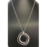 A modern design silver pendant on a 18 inch belcher chain by Jasper Conran.