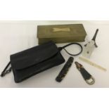 A small vintage black leather handbag by Tula. Detachable strap with interior & exterior pockets.