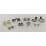 8 pairs of silver stud style earrings, some stone set.