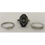 3 stone set silver and white metal dress rings.