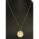 A 9ct gold double sided St. Christopher pendant on a fine belcher chain.