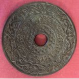 An unusual circular medallion in the style of a Bi disc, with oriental style design.
