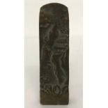A Chinese bronze seal carved with a mountain scene. Character marks to base.