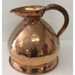An antique copper 2 gallon ale jug of bulbous form.