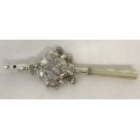 A 925 silver babies rattle with whistle head and mother of pearl handle.