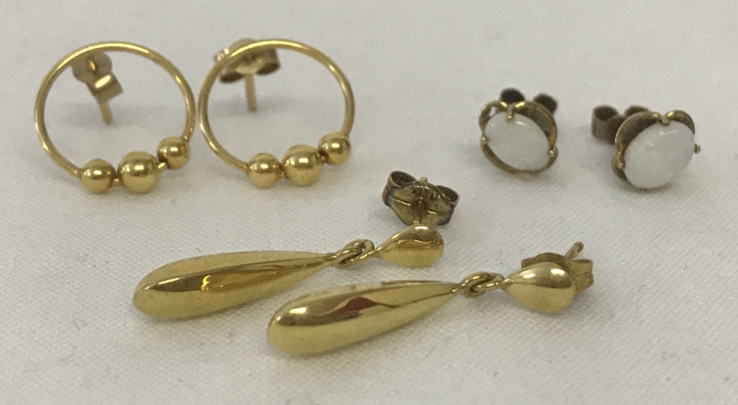 3 pairs of 9ct gold earrings.