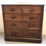 A Victorian mahogany 2 over 3 chest of drawers. With original bun handles and brass locks