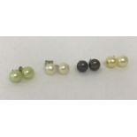 4 pairs of silver and freshwater pearl stud earrings.