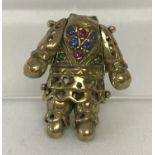A 9ct gold articulated clown pendant suitable for scrap. Stones set to front. Head missing.