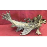 A bronze figurine of a Chinese Dragon fish.