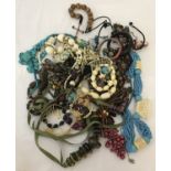 A bag of costume jewellery necklaces, bangles and bracelets.
