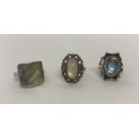 3 modern design silver stone set dress rings.