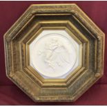 A large, heavy octagonal gilt framed marble plaque depicting an angel.