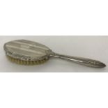 A vintage sterling silver backed decorative ladies hair brush.