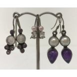 3 pairs of silver earrings set with semi precious stones. All in drop style.