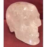 A carved rock crystal ornament in the shape of a skull.
