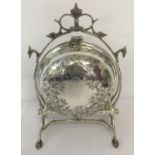 A silver plated folding muffin dish, in the style of a Victorian 2 sectional dish.
