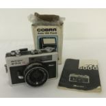 A vintage Ricoh 500G camera, with Rikenon lens, complete with instruction manual.