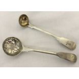 A Georgian silver sugar sifter spoon, hallmarked Solomon Hougham 1815. Crest to handle.