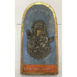 A hand painted Russian icon faced with white metal detail.