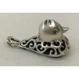 A small sterling silver duck shaped pin cushion with pierced work detail and blue velvet cushion.