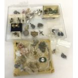 A collection of vintage costume jewellery brooches and earrings.