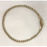 A 9ct gold fine curb chain bracelet with lobster claps. Approx. 7 inches long.