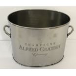 An oval shaped 2 handled Alfred Gratien champagne cooler with engraved detail to front.