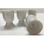 A set of 4 WWII style Kriegsmarine ceramic egg cups.