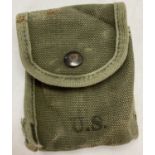 A WWII style US First Aid tin/compass canvas pouch.