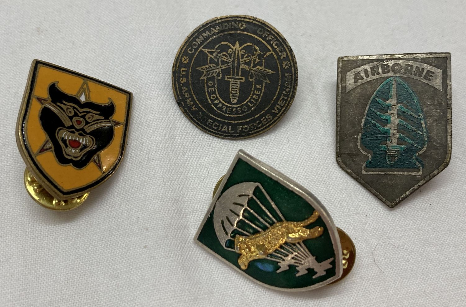 4 Vietnam War style Special Forces lapel badges.