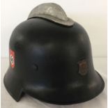 A WWII style German Reichsbahn Fire Service helmet with the city crest of Hamburg to the front.