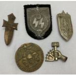 5 assorted WWII style German "Tinny" badges.