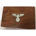 A WWII style German polished walnut box with Nazi Kepi eagle to the lid.