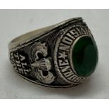 A Vietnam War style US Special Forces ring set with green coloured stone.