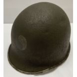 A WWII style US M1 front seam split, fixed bale 29th Infantry Division helmet.